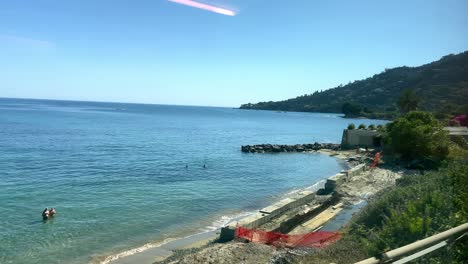 Blue-Sea-And-Coastline-Of-Italy-From-A-Train-Traveling-To-Menton-In-France