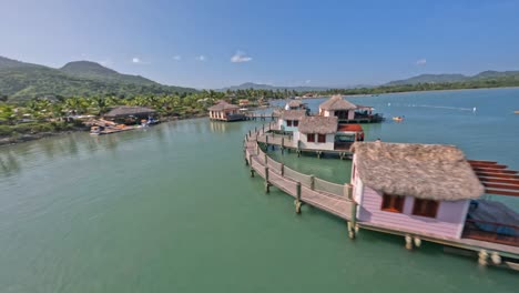 Low-altitude-flight-over-ocean-villas-of-resort-in-Amber-Cove,-Dominican-Republic