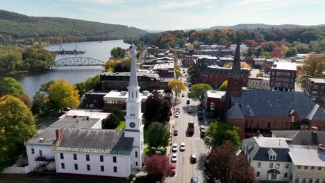 Aerial-Brattleboro-Vermont-with-Churches-in-foreground,-Church-Steeples