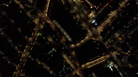 Top-down-aerial-view-of-night-traffic-in-a-big-city