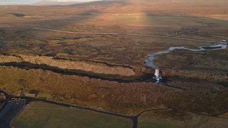 Drone-flying-over-Thingvellir-National-Park-with-Oxararfoss-Waterfall,-Iceland