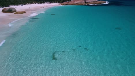 Incredible-location,-aerial-of-crystal-clear-turquoise-waters-of-little-beach-Western-Australia-located-on-two-peoples-bay