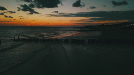 Drone-shot-of-the-sunset-on-the-beach-of-the-Netherlands