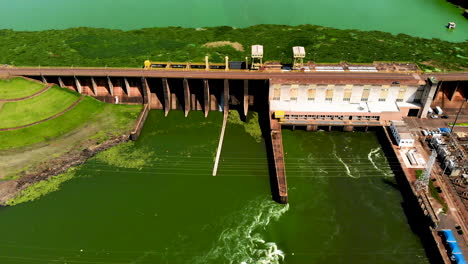 Aerial-view-of-Dam-at-reservoir-with-flowing-water,-hydroelectricity-power-station