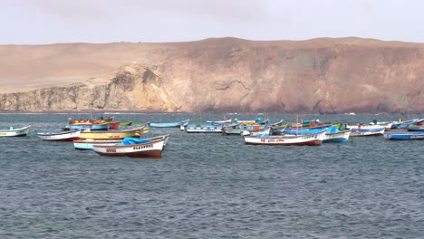 Moored-fishing-boats-swaying-in-the-water,-Paracas-National-Reserve-Per?