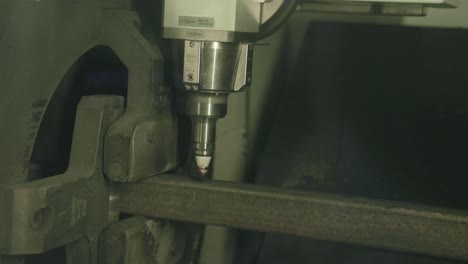 Fast-footage-of-a-laser-cutting-machine-cutting-through-a-steel-frame-pipe