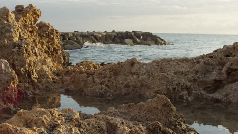 Tranquil-Sunset-of-Mediterranean-Sea-and-Rock-Formations-in-Cyprus,-Slow-Motion,-Wide