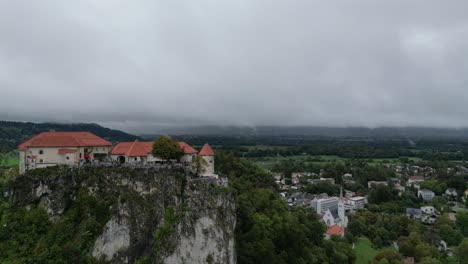 Bled-Castle-Slovenia-drone-aerial-view-reveal-stormy-weather-in-background