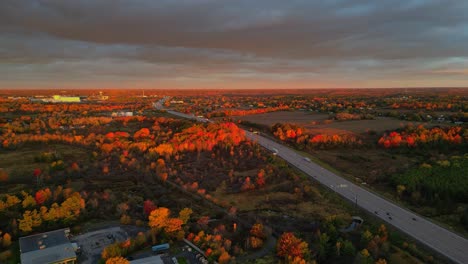 Aerial-movement-fall-morning-light-over-a-highway