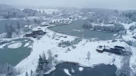 Magnificent-aerial-drone-shot-of-a-town-covered-with-snow-in-winters