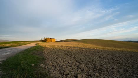 Time-lapse-of-a-freshly-tilled-farm-field-while-the-sun-sets