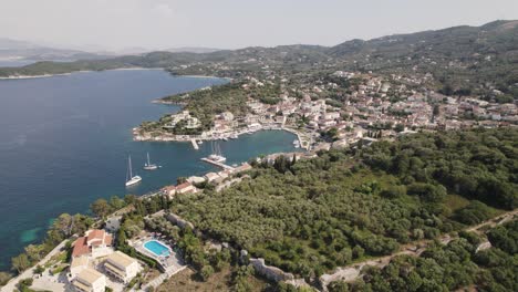 Aerial-view-of-quaint-coastal-village-of-Kassiopi,-Corfu,-Greece