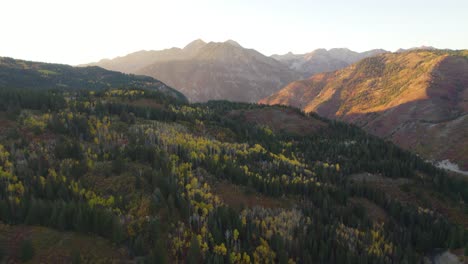 American-Fork-Canyon-mountain-pass-landscape-in-autumn-sunset,-drone