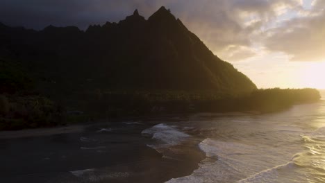 Dramatic-aerial-footage-of-famous-Haena-park,-and-Kalalau-trail-by-NaPali-coast-during-sunset