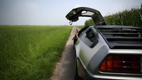 DMC-DeLorean-opening-door-and-throwing-out-dinosaur-toy