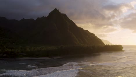 Dramatic-aerial-footage-of-famous-Haena-park,-and-Kalalau-trail-by-NaPali-coast-during-sunset