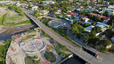 Luftaufnahme-Der-Neuen-Infrastrukturentwicklungen-Des-Neuen-Kinderspielplatzes-Und-Der-Habibie-brücke-über-Den-Innerstädtischen-Fluss-In-Der-Hauptstadt-Dili,-Timor-Leste,-Südostasien