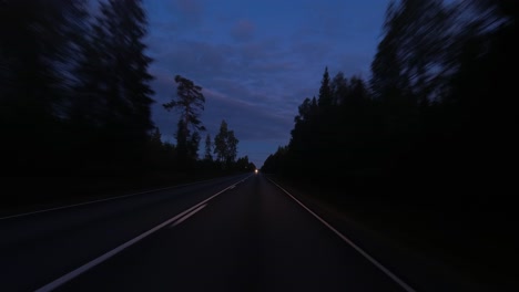 POV:-Highway-curves-to-oncoming-headlights-through-blue-hour-forest