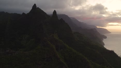 Beautiful-nature-drone-view-of-green-mountain-peaks-revealing-tropical-beach-on-Na-Pali-park-4K