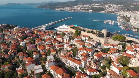 Aerial-Point-of-Interest-Shot-of-Kavala-Old-Town-Fortress-and-Port-with-Cruise-Ships,-Cinematic-4K-Footage
