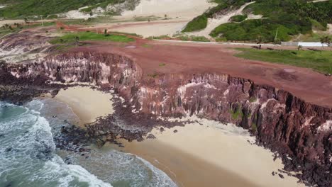 Over-View-of-Two-Cove-Like-Beaches-Side-by-Side-with-Red-Dirt-Desert-Cliffsides