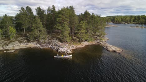 Canoers-paddling-between-islands-on-a-big-Scandinavian-lake-in-Glaskogen