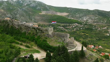 Rear-aerial-approach-of-the-fortress-of-Klis-in-Split,-Croatia