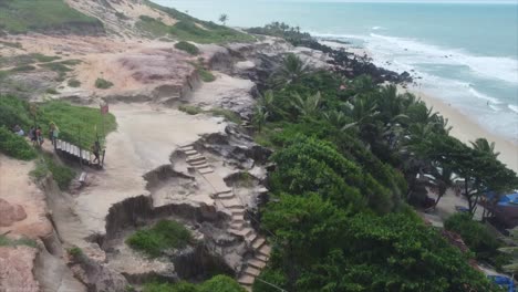 Cliffside-Brazilian-Beach-Stairs-Pan-up-Shot-to-Overlook-Of-Beach