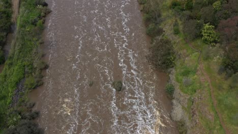 AERIAL-TOP-DOWN-Rapids-Flowing-Downstream-After-Heavy-Rain-Event