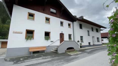 Village-house-and-moving-across-to-a-garden-in-the-Tyrol,-Austria