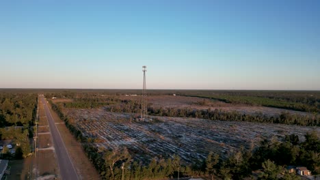 drone-view-slowly-rotating-around-cell-tower-in-Florida-panhandle