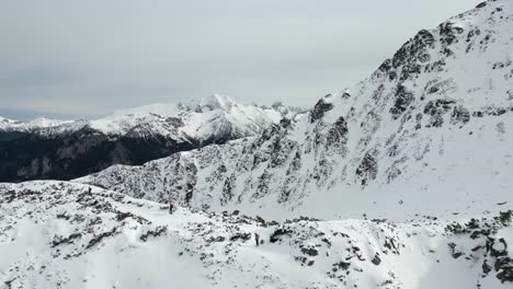 Hiking-along-snowcapped-peaks-in-the-Tatras-Mountains-in-Morskie-Oko-Park-in-Zakopane-Poland