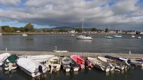 Ebbing-river-tide-flows-past-boats-in-small-Irish-marina,-Dungarvan