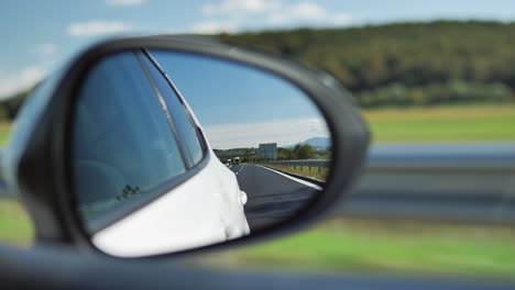 Side-mirror-of-a-white-car