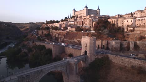 An-upward-drone-shot-of-Toledo-and-its-bridges-at-sunrise