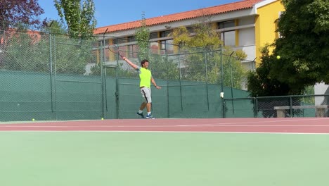 Tennis-Player-Hits-The-Ball-And-Expresses-Achievement-For-Scoring