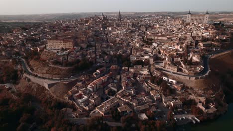 A-backward-drone-shot-of-Toledo-and-its-cathedral-at-sunset