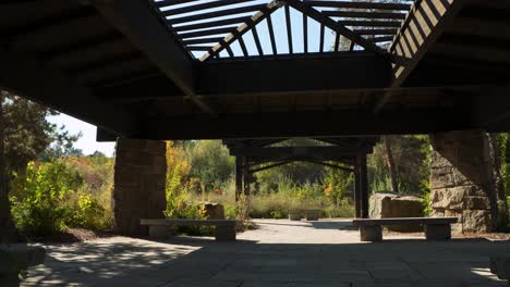 Slow-pan-on-a-large-gazebo-with-benches-and-a-skylight-in-Boise,-Idaho-on-a-fall-day