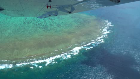 Great-Barrier-Reef-Scenic-Flight-Aerial-Shot-out-of-plane-window