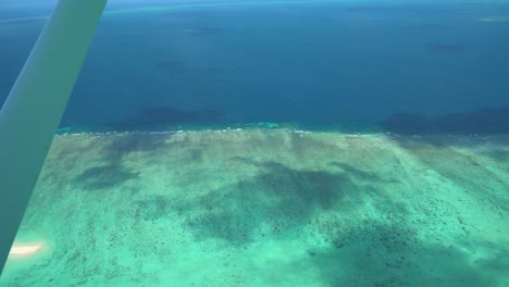 Great-Barrier-Reef-Scenic-Flight-Aerial-Shot-out-of-plane-window