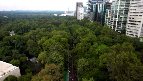 aerial-drone-shot-of-the-runners-of-the-mexico-city-marathon-passing-through-the-polanco-neighborhood