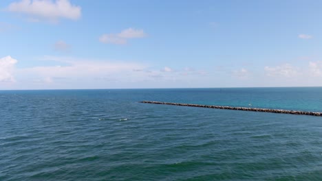 Vast-ocean-view-showing-lone-waters-with-a-rock-walkway