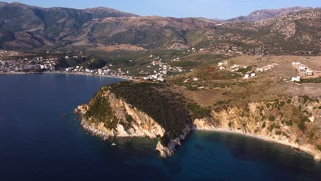 AERIAL-Panning-Shot-of-a-Beautiful-Turquoise-Coastline-in-Himare,-Albania