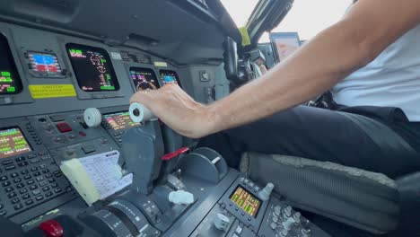 Close-view-of-jet-flight-controls-and-engine-throttles-while-copilot-is-landing