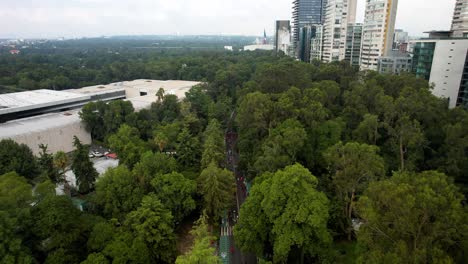 aerial-drone-shot-of-the-runners-of-the-mexico-city-marathon-passing-through-the-museum-of-anthropology
