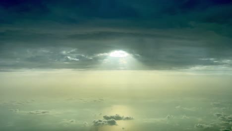 Awesome-aerial-cockpit-view-of-a-dark-and-cloudy-sky-with-a-gap-and-sunbeam-through-the-hole