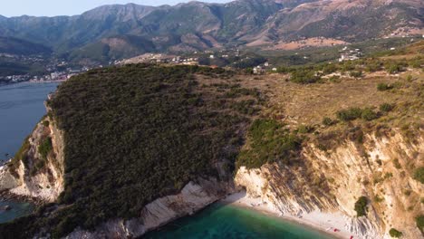 AERIAL-Revealing-Shot-of-the-Beautiful-Turquoise-Beach-in-Himare,-Albania