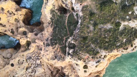 Birdseye-view-of-karst-rock-formations-surrounded-the-beautiful-blue-water