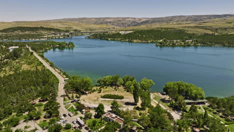Ankara-Turkey-Aerial-v6-low-level-drone-flyover-yeni-bayındır-neighborhood-capturing-landscape-of-pristine-water-dam-in-blue-lake-recreational-park-in-summer---Shot-with-Mavic-3-Cine---July-2022