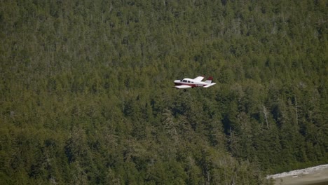 Light-Private-Plane-Flying-over-Dense-Forest,-Air-to-Air-View